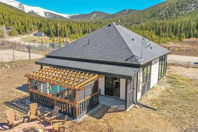 a terrace of a house with wooden floor and outdoor space