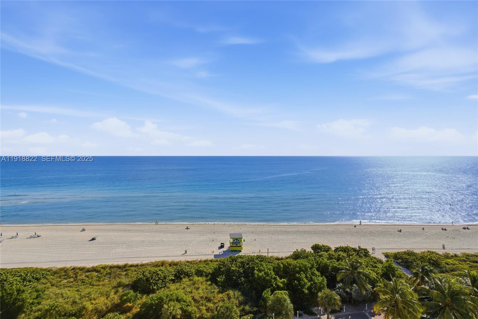 5555 Collins Avenue, Unit 12N Miami Beach, FL 33140 - Photo 14 of 49 a view of beach and ocean