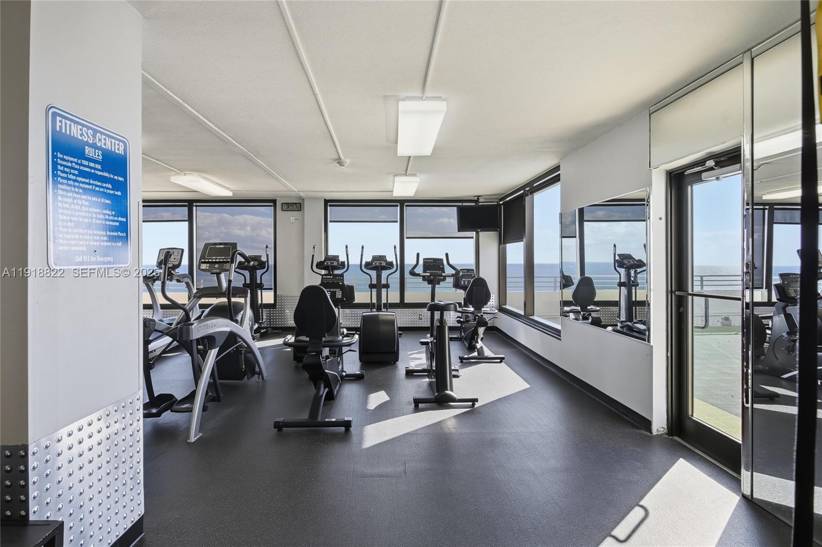 5555 Collins Avenue, Unit 12N Miami Beach, FL 33140 - Photo 38 of 49 a view of a room with gym equipment
