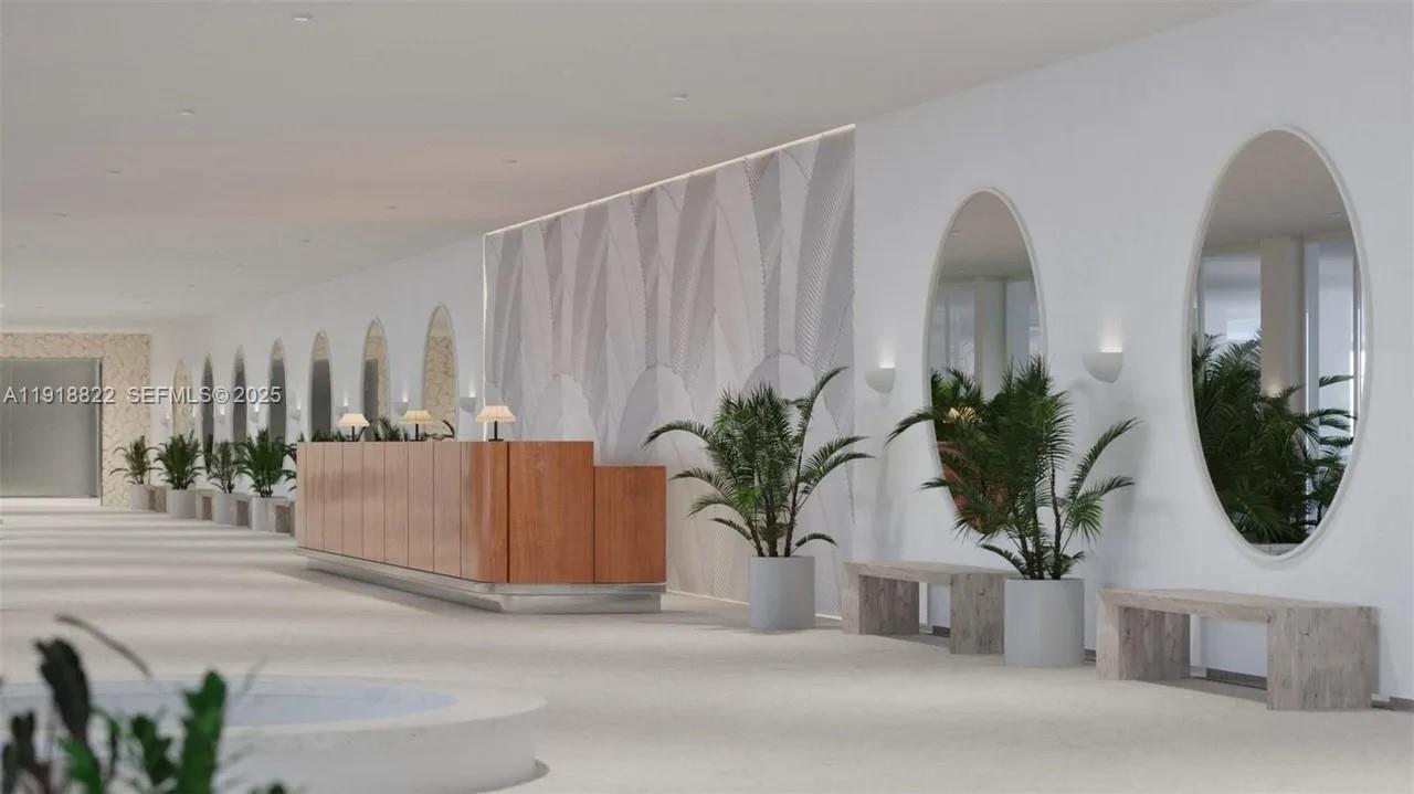 5555 Collins Avenue, Unit 12N Miami Beach, FL 33140 - Photo 42 of 49 a potted plant sitting on top of a wooden floor