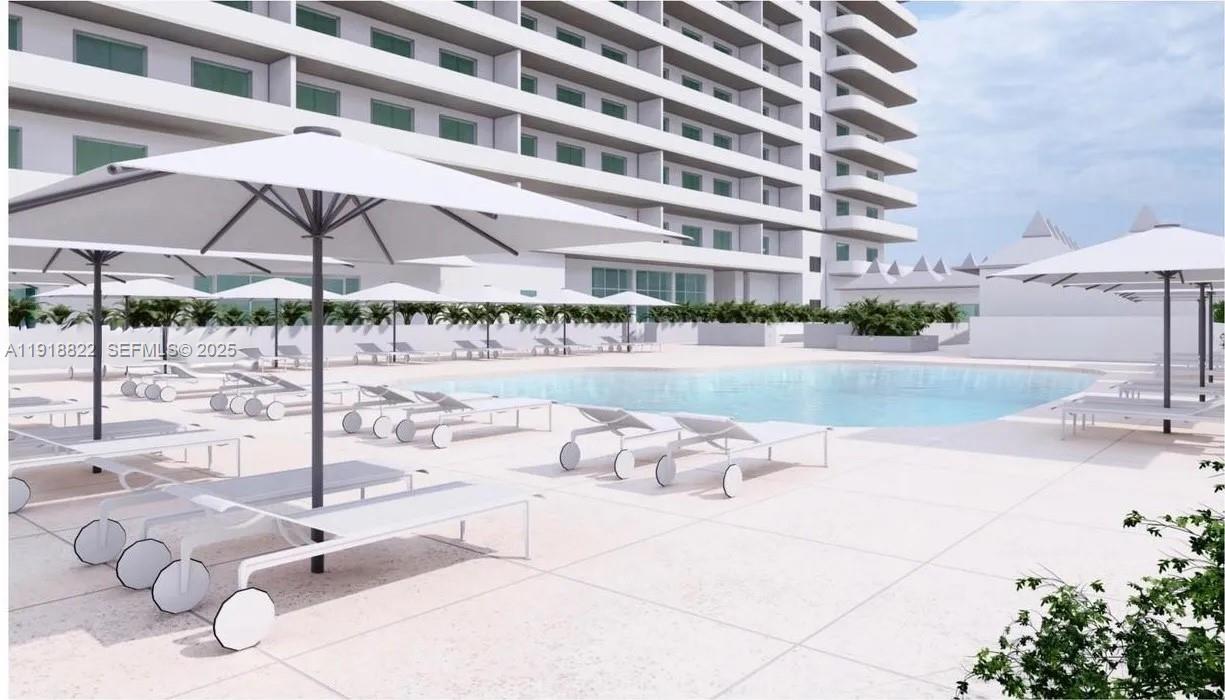 5555 Collins Avenue, Unit 12N Miami Beach, FL 33140 - Photo 46 of 49 a outdoor space with pool and patio