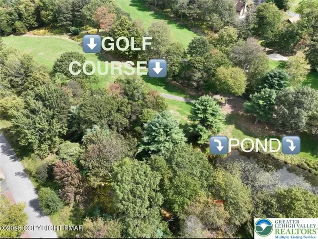 a view of a golf course with a lake