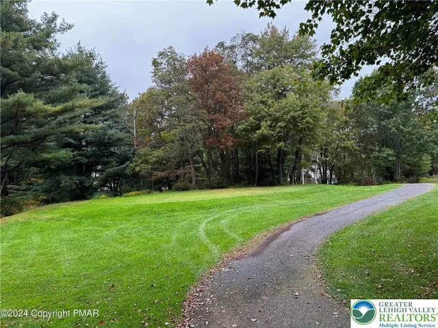 a fire hydrant in the middle of a field
