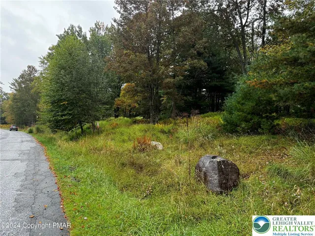 a view of a house with a big yard