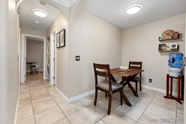 a view of a room with furniture and wooden floor