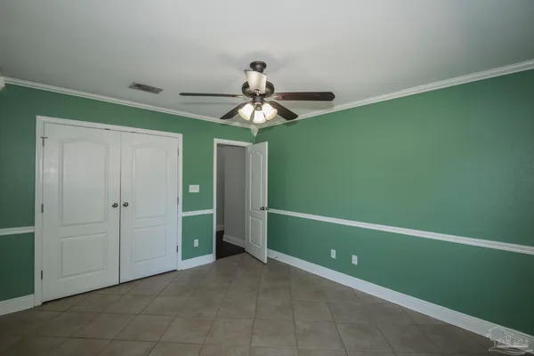 a view of a room with a fan and a fan