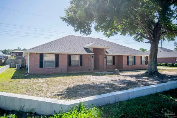 a view of a house with a yard
