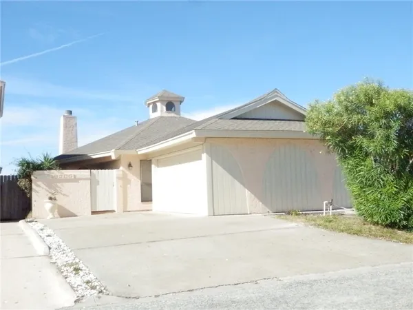 a front view of a house with a garage