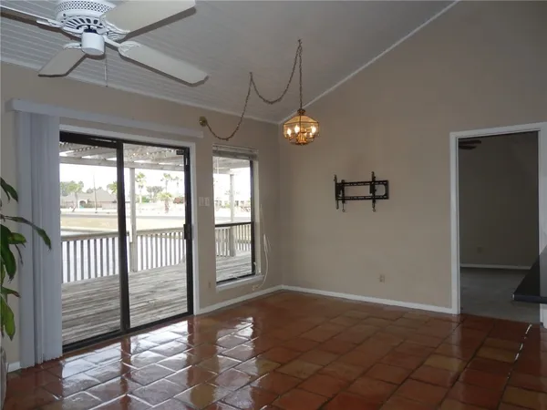 a view of a livingroom with a ceiling fan and window