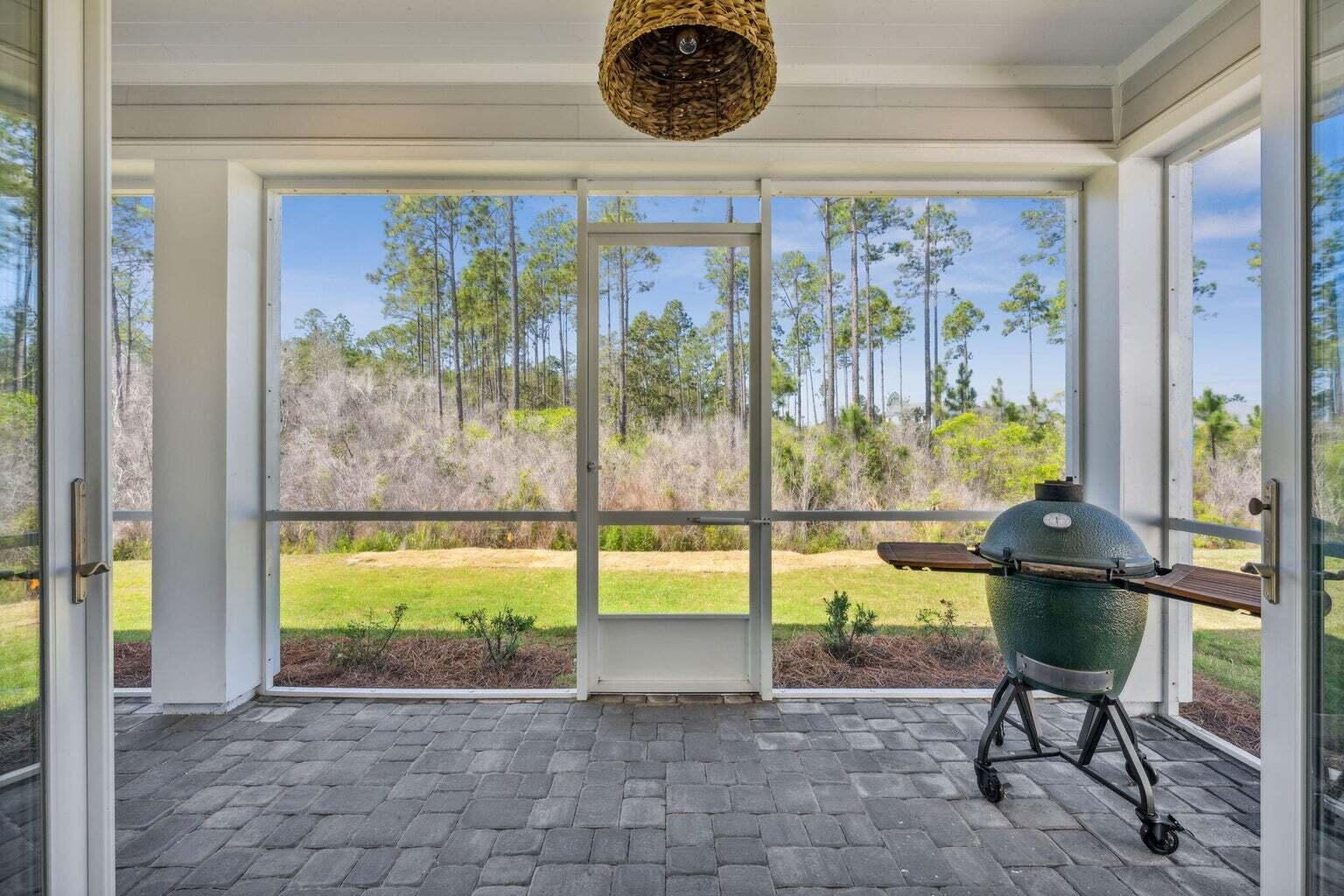 92 East Lafayette Rd Inlet Beach Inlet Beach, FL 32461 - Photo 30 of 51 a view of porch with a table and chairs