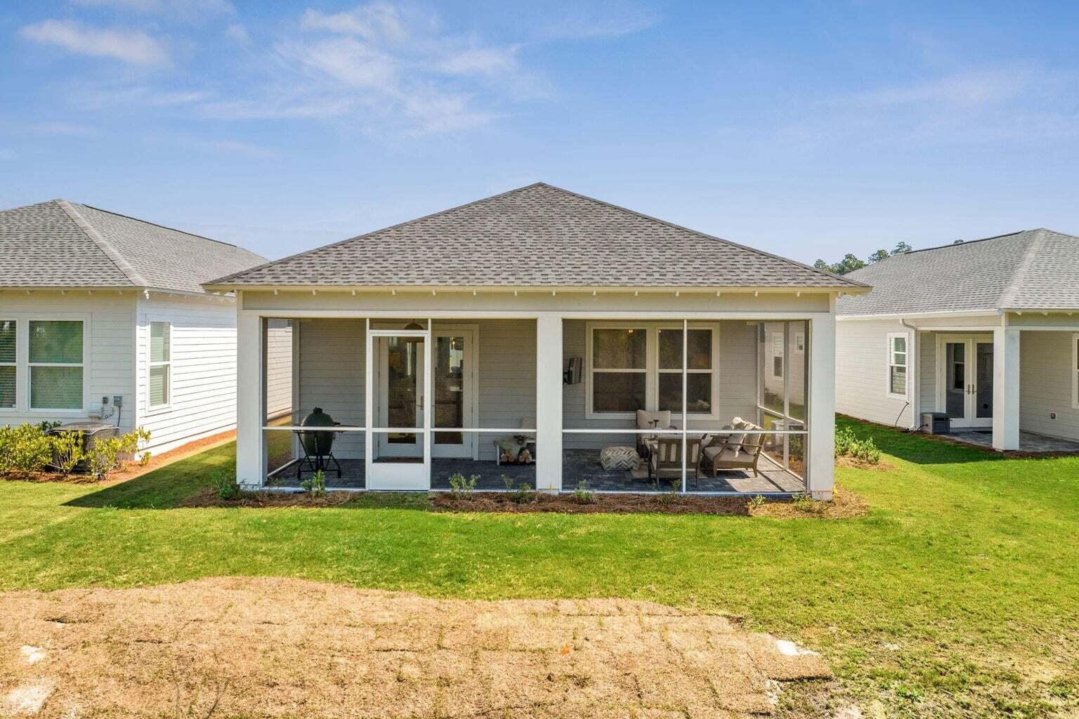 92 East Lafayette Rd Inlet Beach Inlet Beach, FL 32461 - Photo 34 of 51 a house view with sitting space garden view with a large tree in front of it
