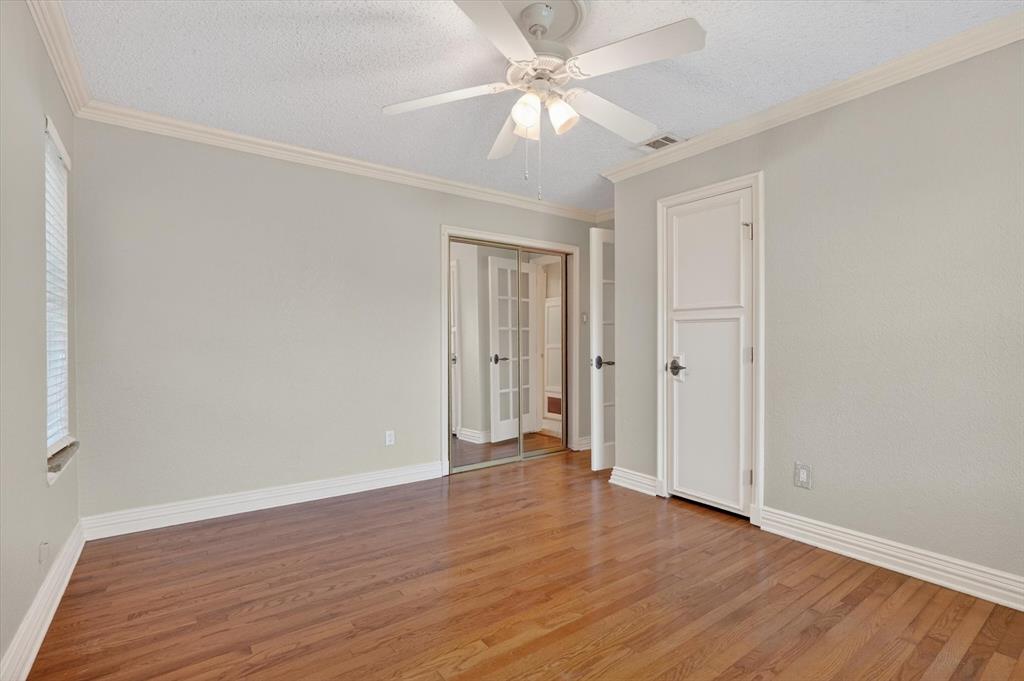 272 Lodge Road Coppell, TX 75019 - Photo 11 of 24 a view of an empty room with wooden floor