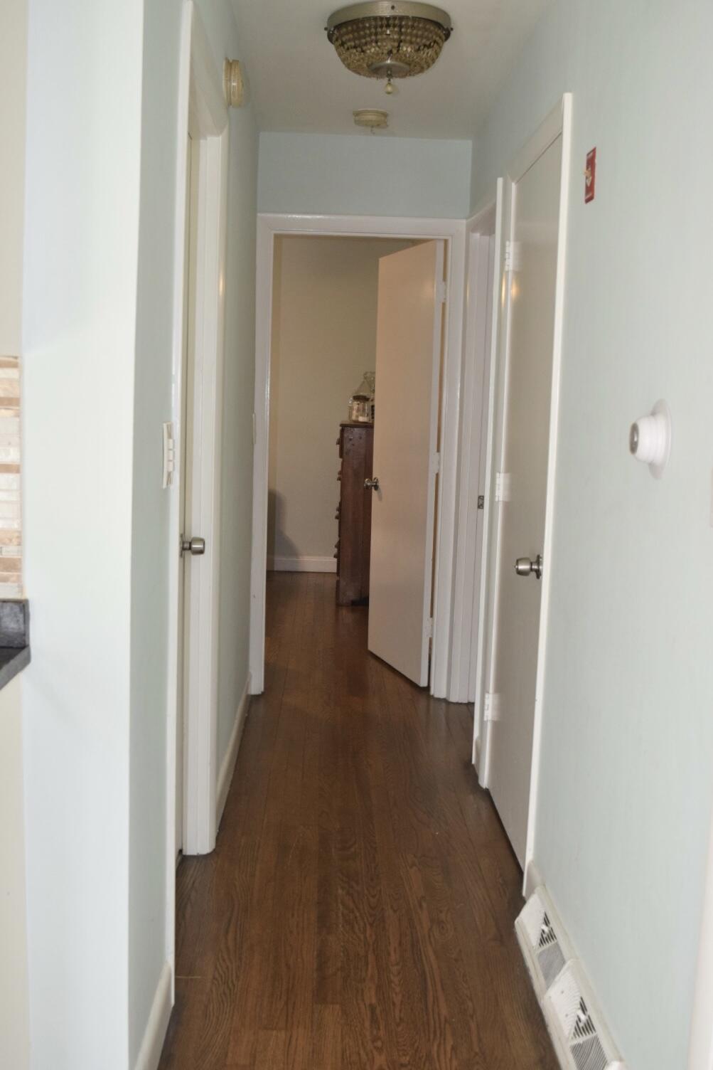 140 Mitchells Way Hyannis, MA 02601 - Photo 13 of 45 a view of a hallway with wooden floor and closet