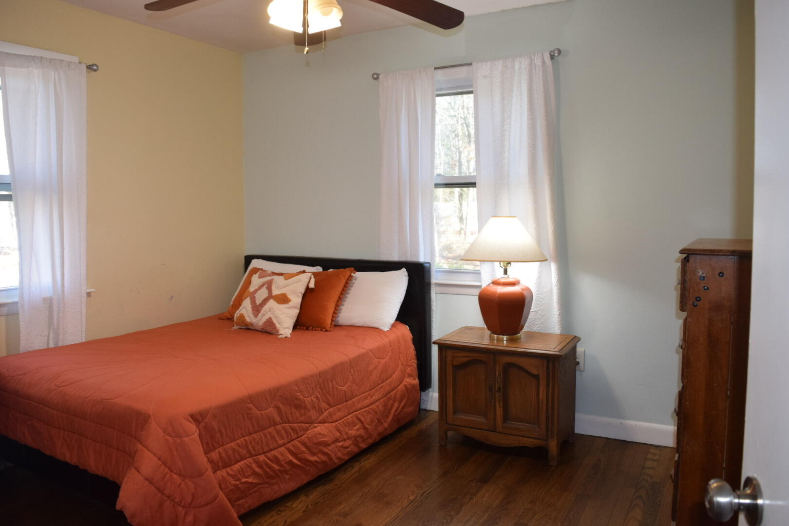 140 Mitchells Way Hyannis, MA 02601 - Photo 16 of 45 a bedroom with a bed and a chandelier