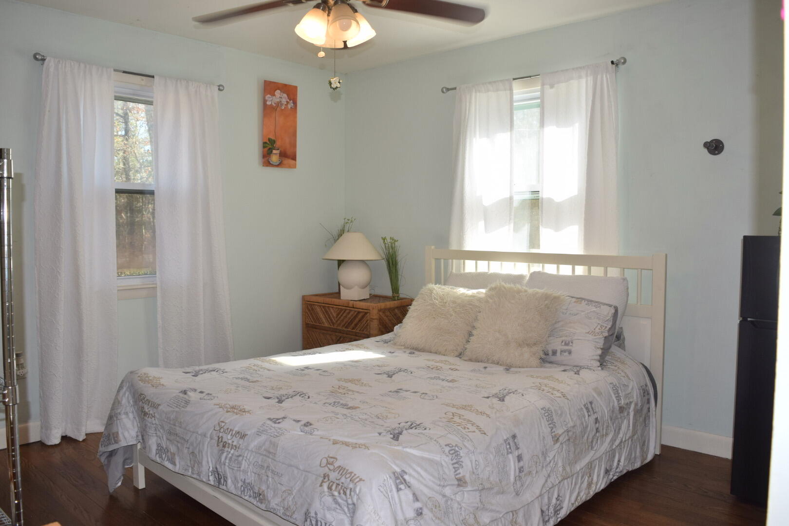 140 Mitchells Way Hyannis, MA 02601 - Photo 17 of 45 a bedroom with a bed and a chandelier