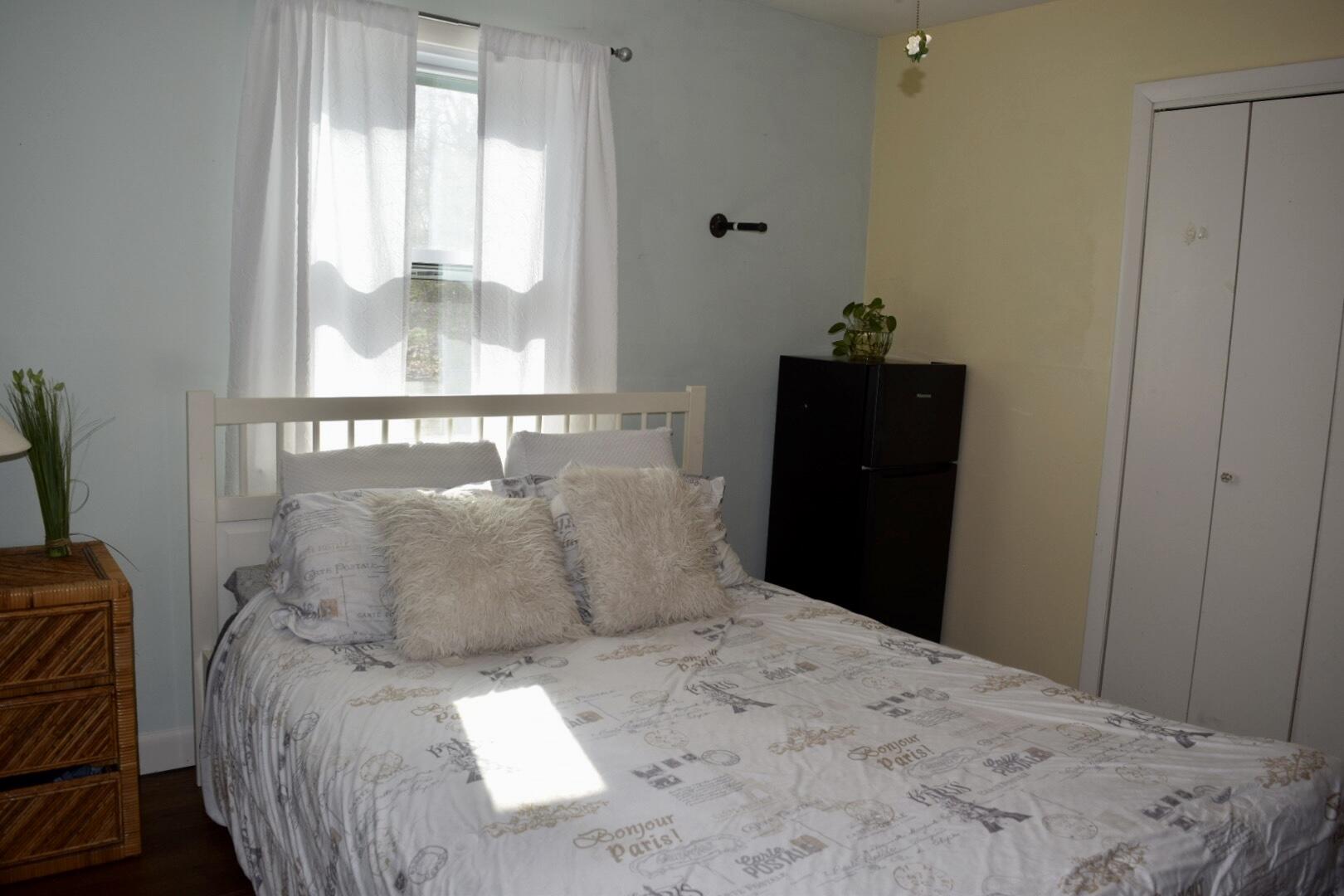 140 Mitchells Way Hyannis, MA 02601 - Photo 18 of 45 a bedroom with a bed and wooden floor