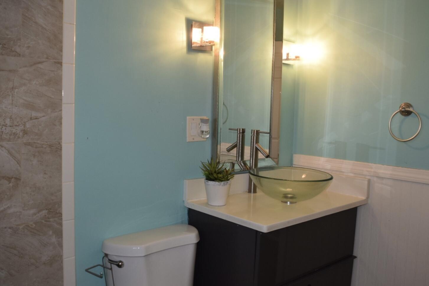 140 Mitchells Way Hyannis, MA 02601 - Photo 21 of 45 a bathroom with a sink and a toilet