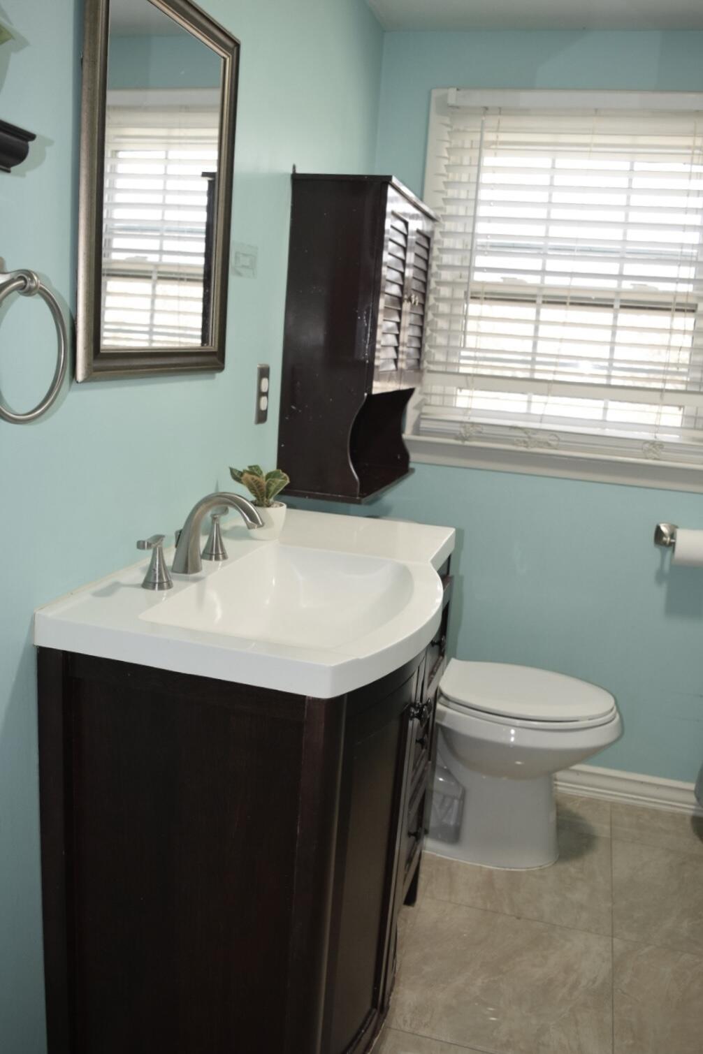 140 Mitchells Way Hyannis, MA 02601 - Photo 26 of 45 a bathroom with a sink toilet and mirror