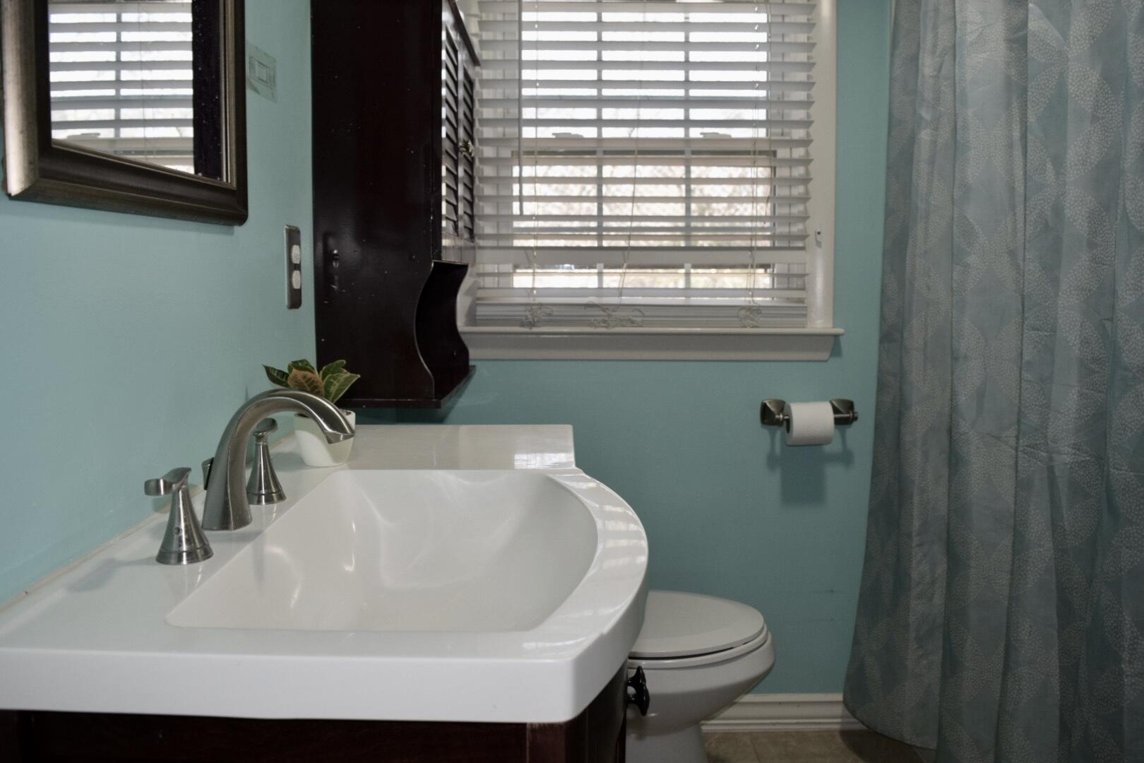 140 Mitchells Way Hyannis, MA 02601 - Photo 27 of 45 a bathroom with a sink a toilet and a window