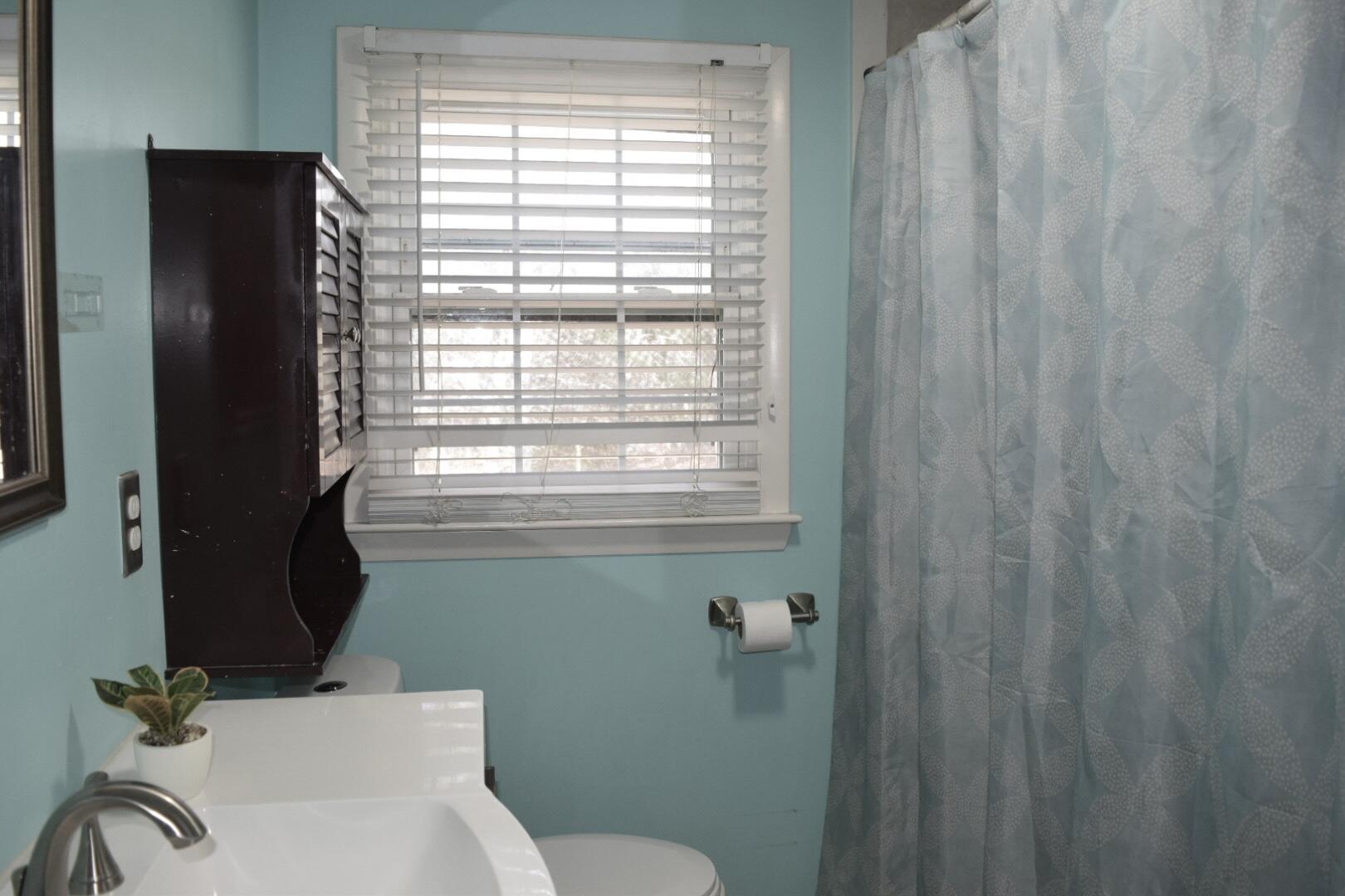 140 Mitchells Way Hyannis, MA 02601 - Photo 28 of 45 a bathroom with a sink a toilet and a mirror