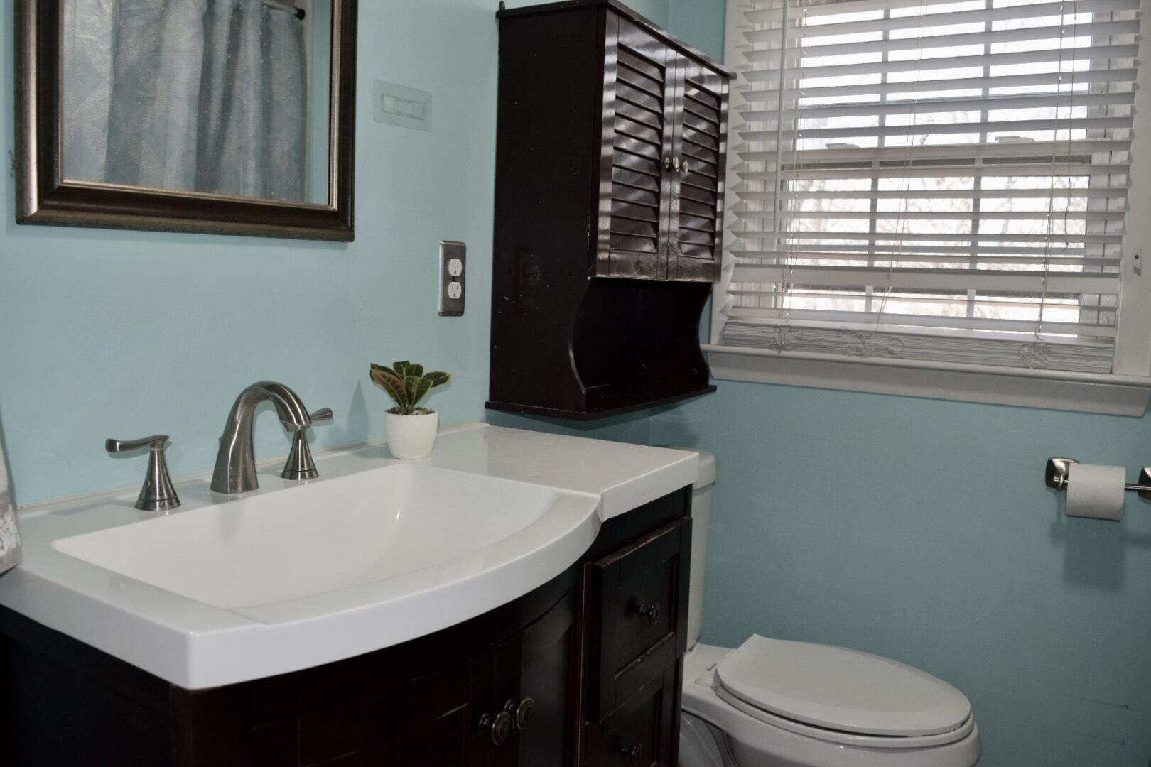 140 Mitchells Way Hyannis, MA 02601 - Photo 29 of 45 a bathroom with a sink a toilet and a mirror