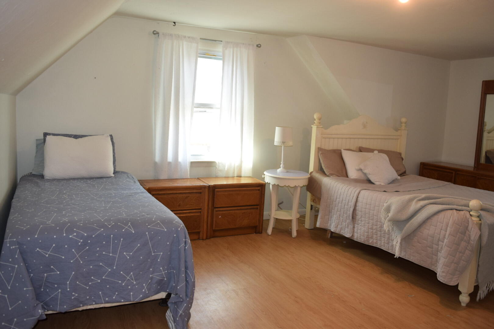 140 Mitchells Way Hyannis, MA 02601 - Photo 30 of 45 a bedroom with a bed and a dresser