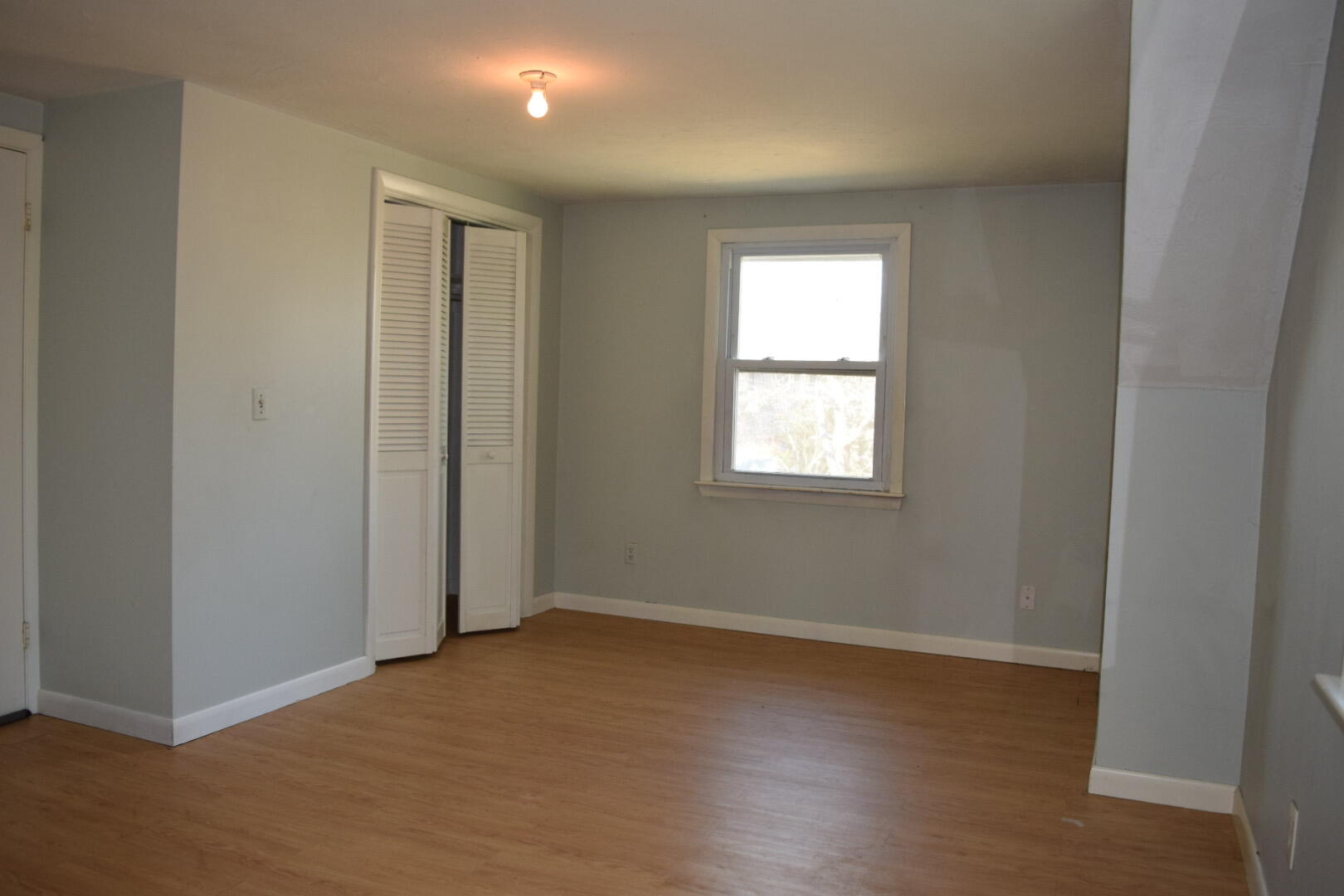 140 Mitchells Way Hyannis, MA 02601 - Photo 37 of 45 a view of an empty room with wooden floor and a window