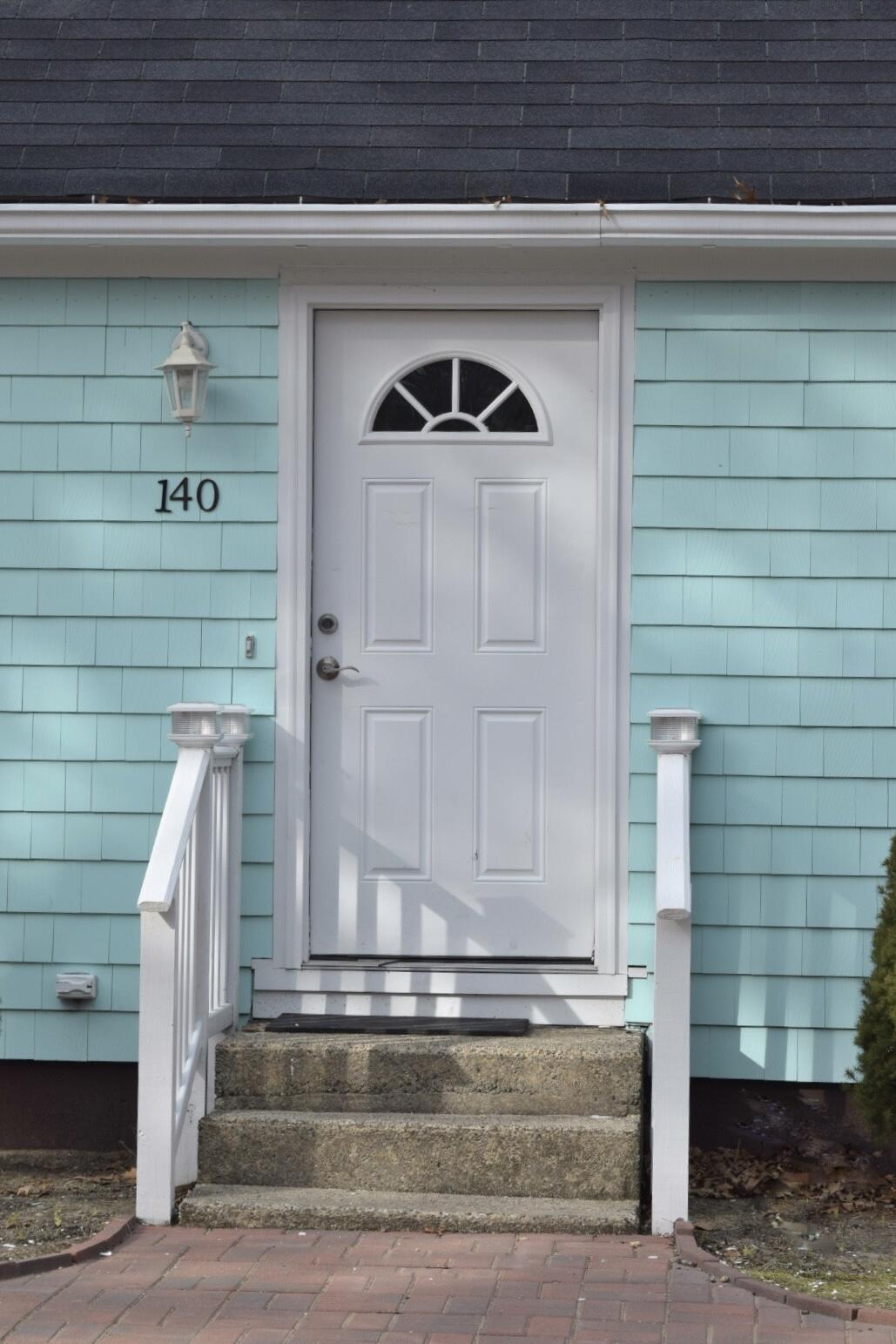 140 Mitchells Way Hyannis, MA 02601 - Photo 4 of 45 a front view of a house with entryway