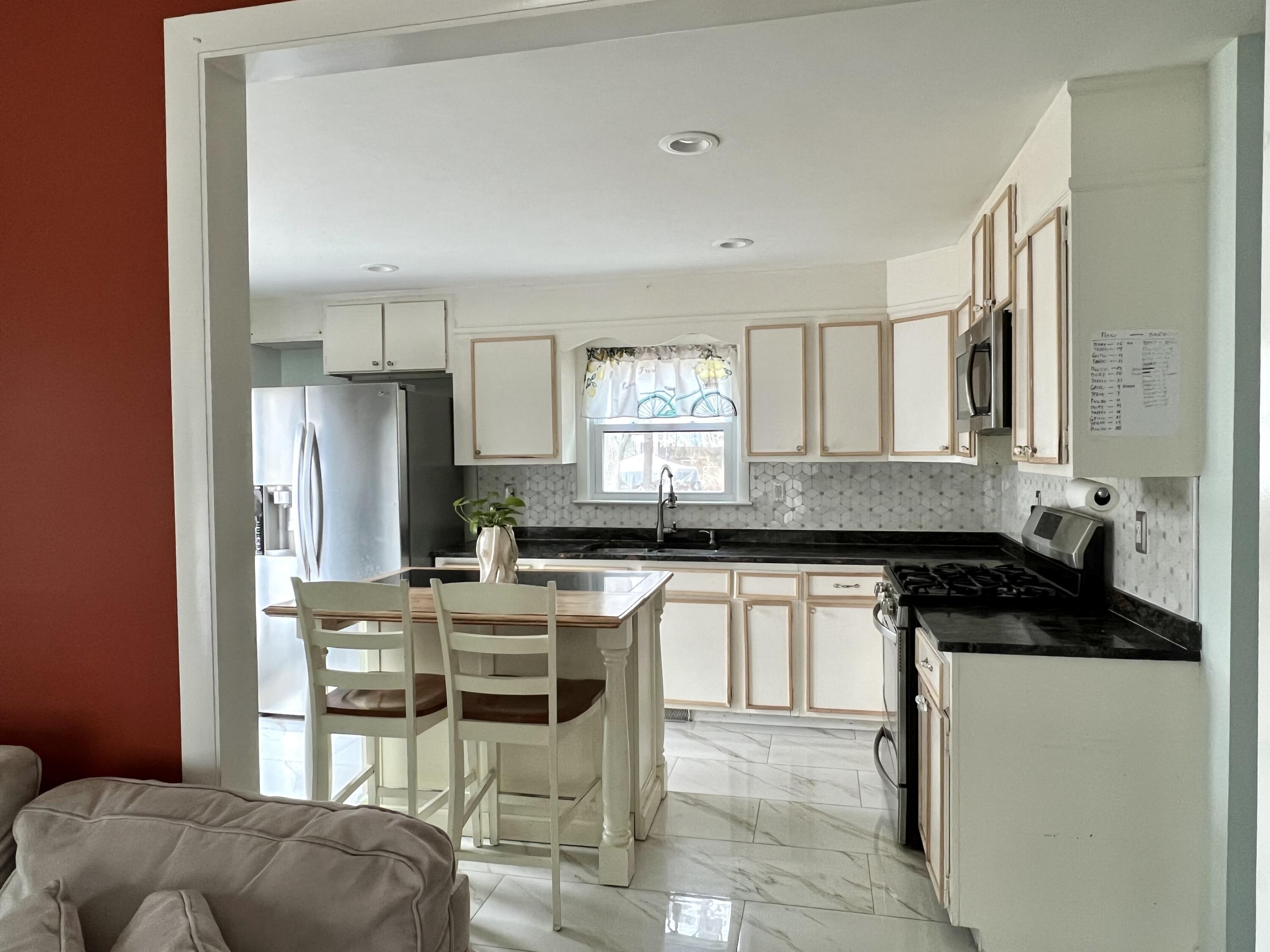140 Mitchells Way Hyannis, MA 02601 - Photo 9 of 45 a kitchen with stainless steel appliances granite countertop a stove a sink and a refrigerator