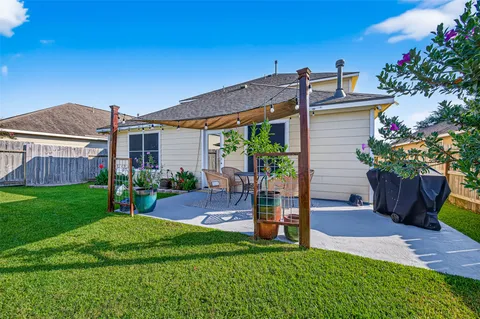 a front view of a house with garden and plants