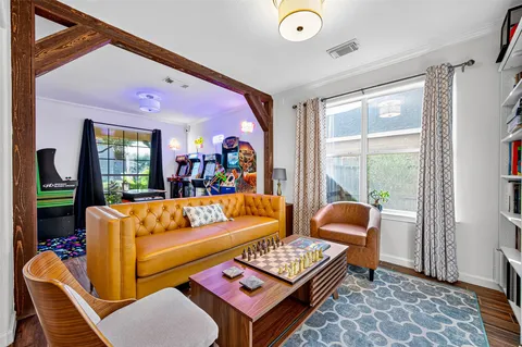 a living room with furniture and a window