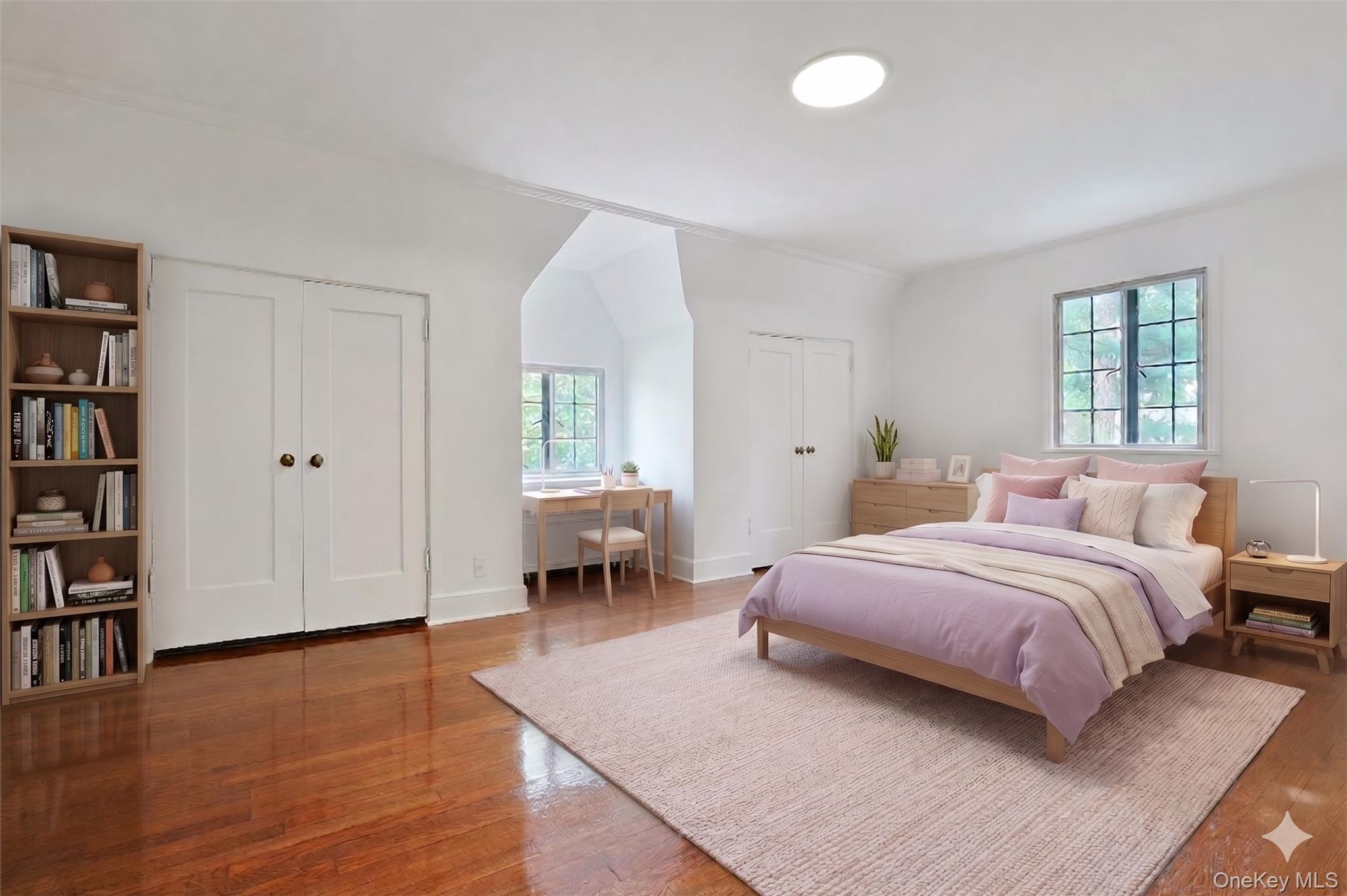 14 Withington Road Scarsdale, NY 10583 - Photo 23 of 41 a bedroom with a bed and a book shelf