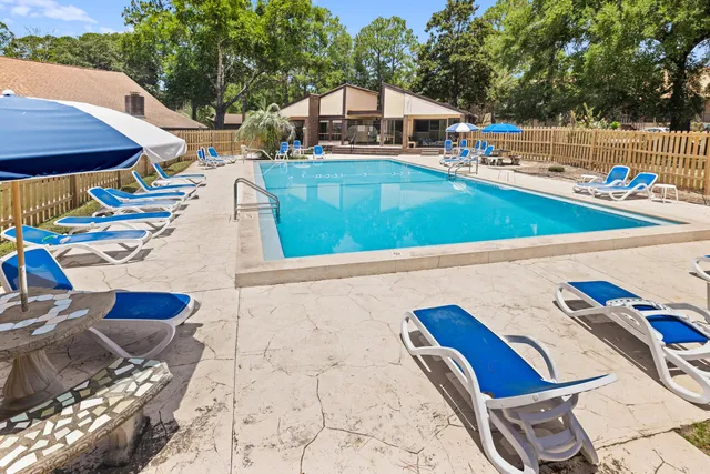 a view of swimming pool with chairs