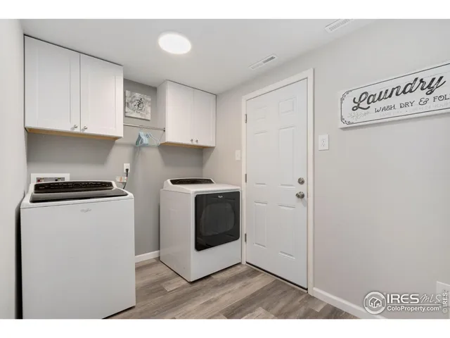 a kitchen with cabinets and stainless steel appliances
