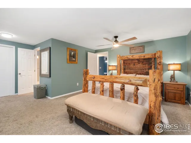 a bedroom with furniture and wooden floor