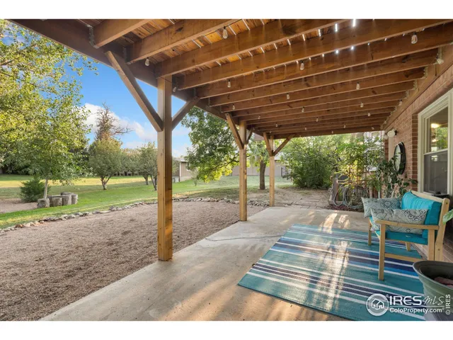 a view of a swimming pool with an outdoor space and seating area