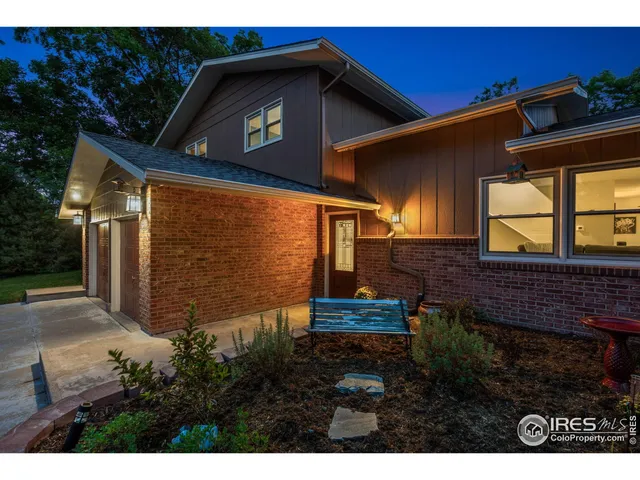 a view of a house with a small yard