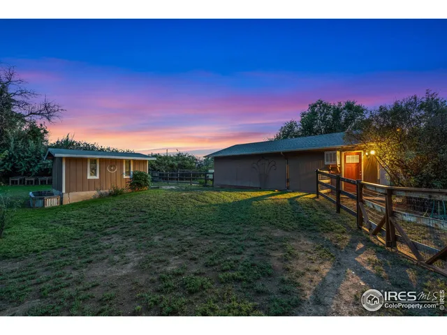 a view of an house with backyard space and garden