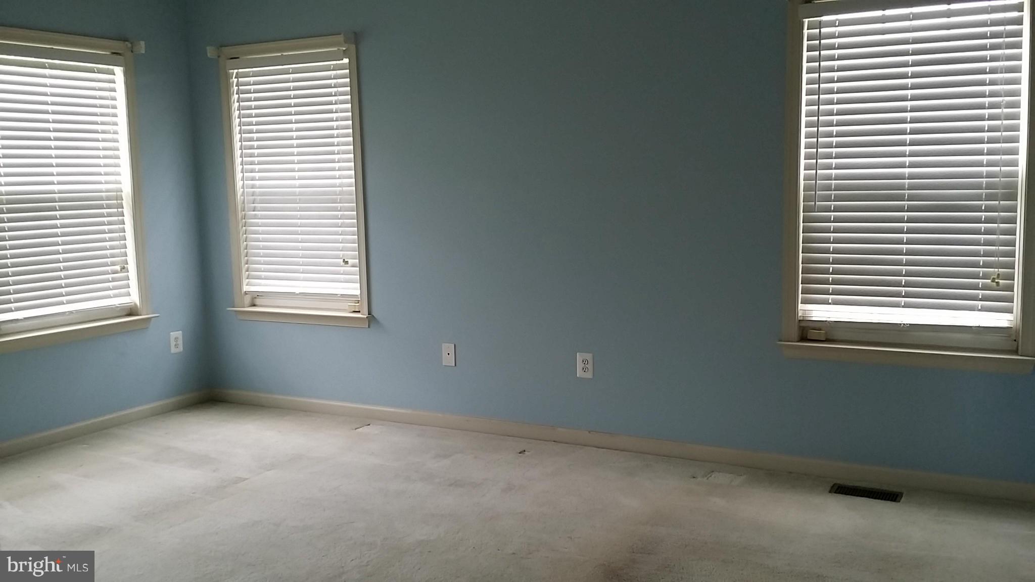 2706 Rona Road Baltimore, MD 21207 - Photo 7 of 10 a view of an empty room with a window