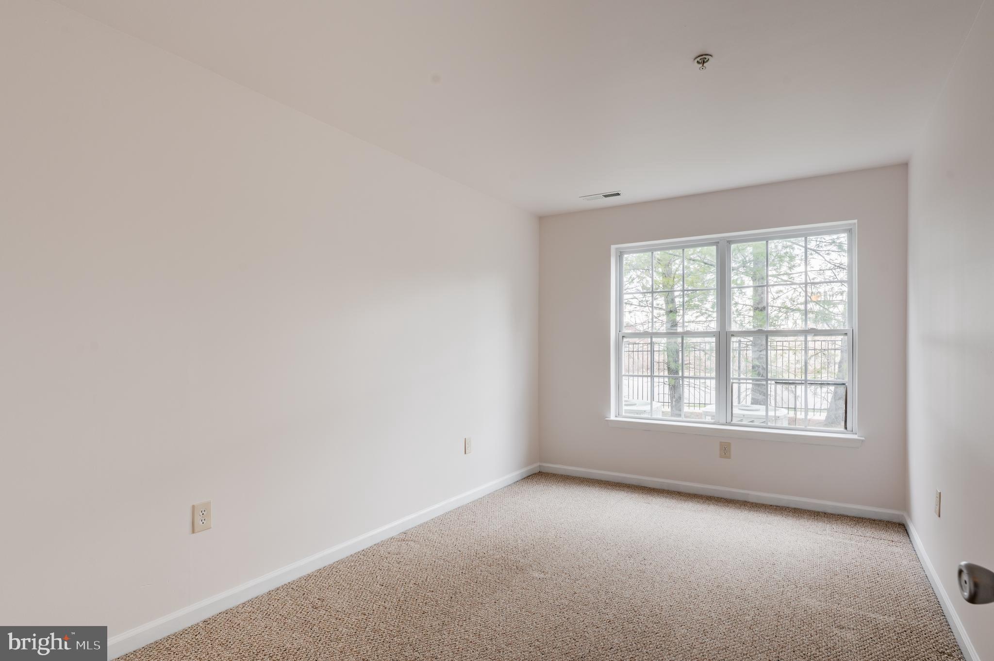 9228 Blue Grass Road, Unit 39 Philadelphia, PA 19114 - Photo 11 of 21 an empty room with a window