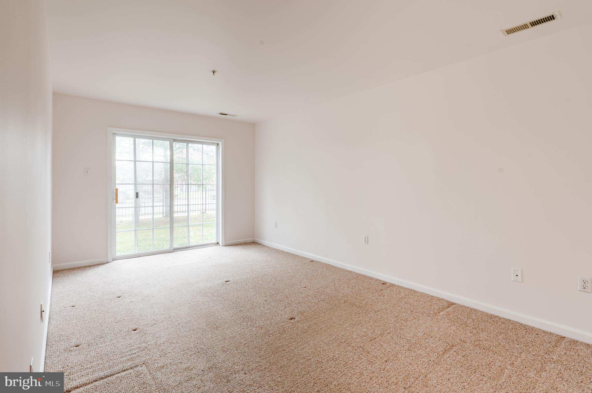 9228 Blue Grass Road, Unit 39 Philadelphia, PA 19114 - Photo 14 of 21 a view of an empty room with a window