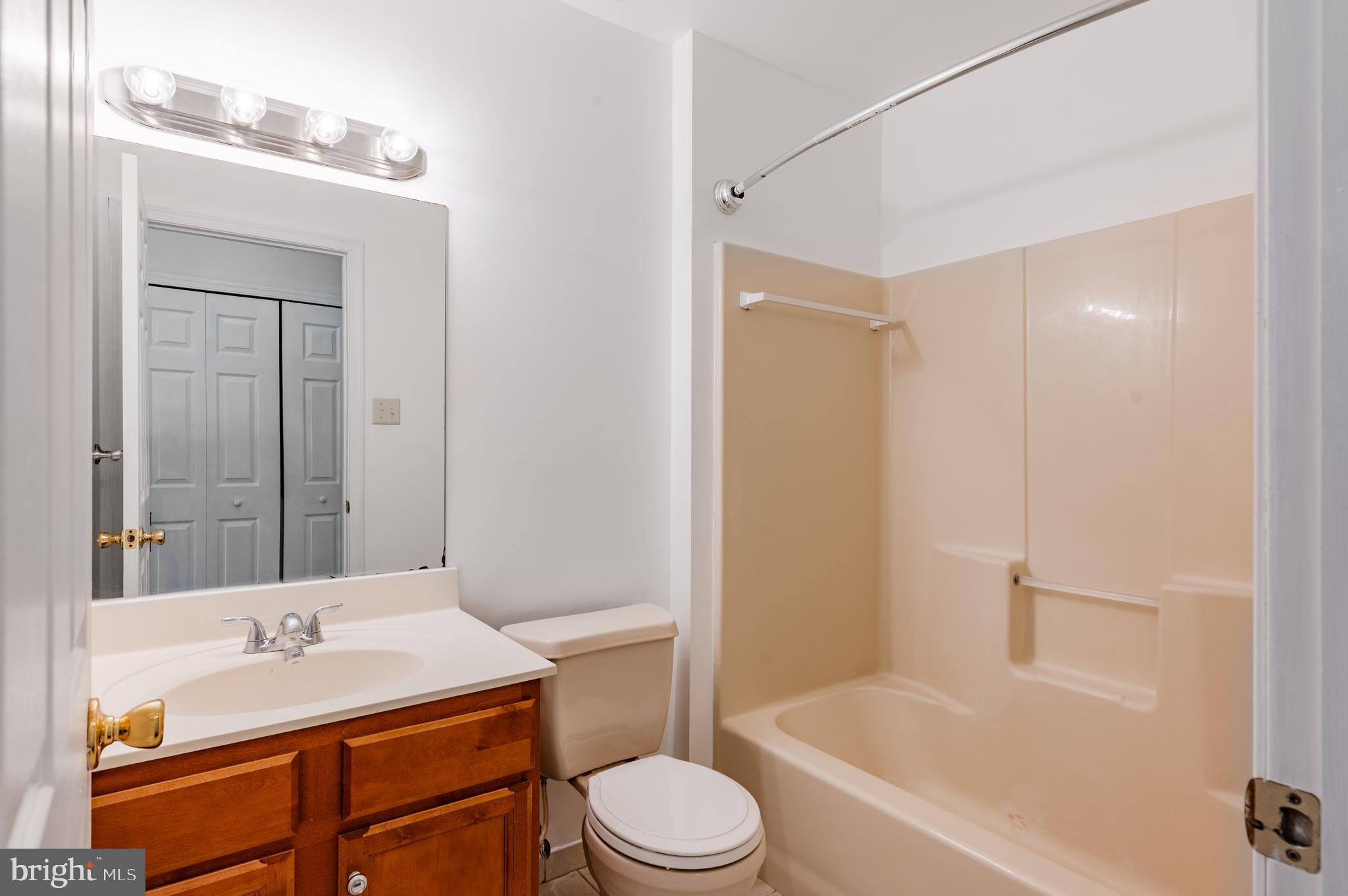 9228 Blue Grass Road, Unit 39 Philadelphia, PA 19114 - Photo 15 of 21 a bathroom with a sink toilet vanity and tub