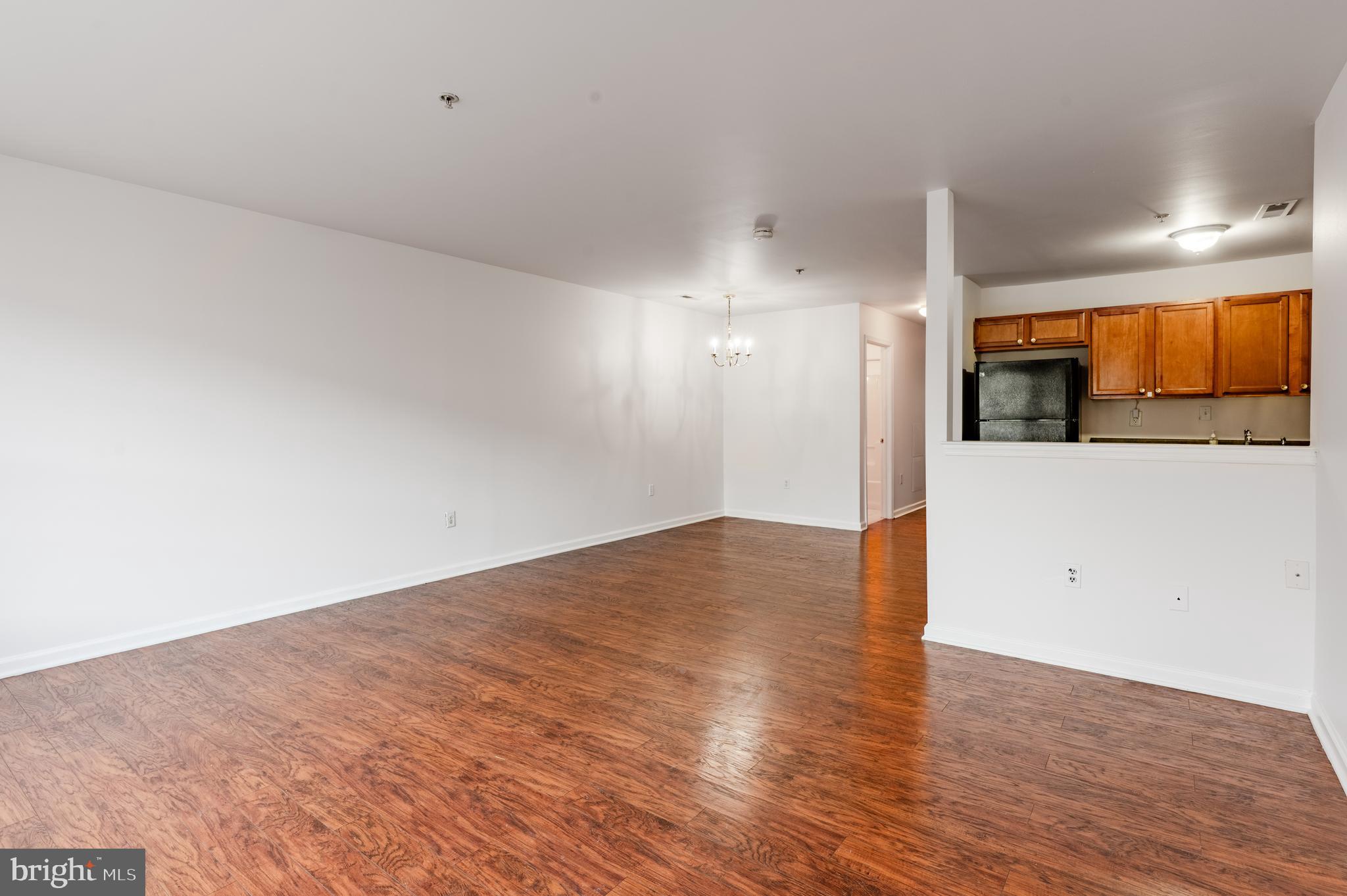 9228 Blue Grass Road, Unit 39 Philadelphia, PA 19114 - Photo 2 of 21 a view of empty room with wooden floor