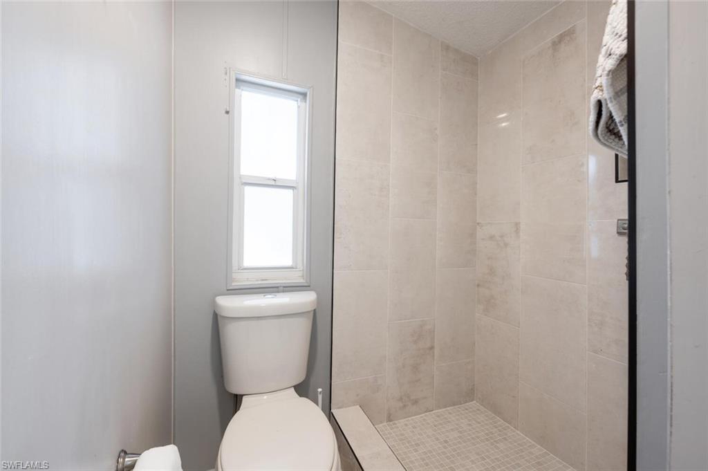 128 Mediterranean Way, Unit 128 Naples, FL 34104 - Photo 18 of 41 Remodeled master shower
