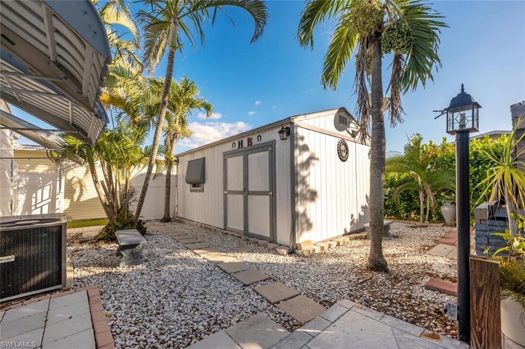 128 Mediterranean Way, Unit 128 Naples, FL 34104 - Photo 25 of 41 Oversized shed with lots of storage