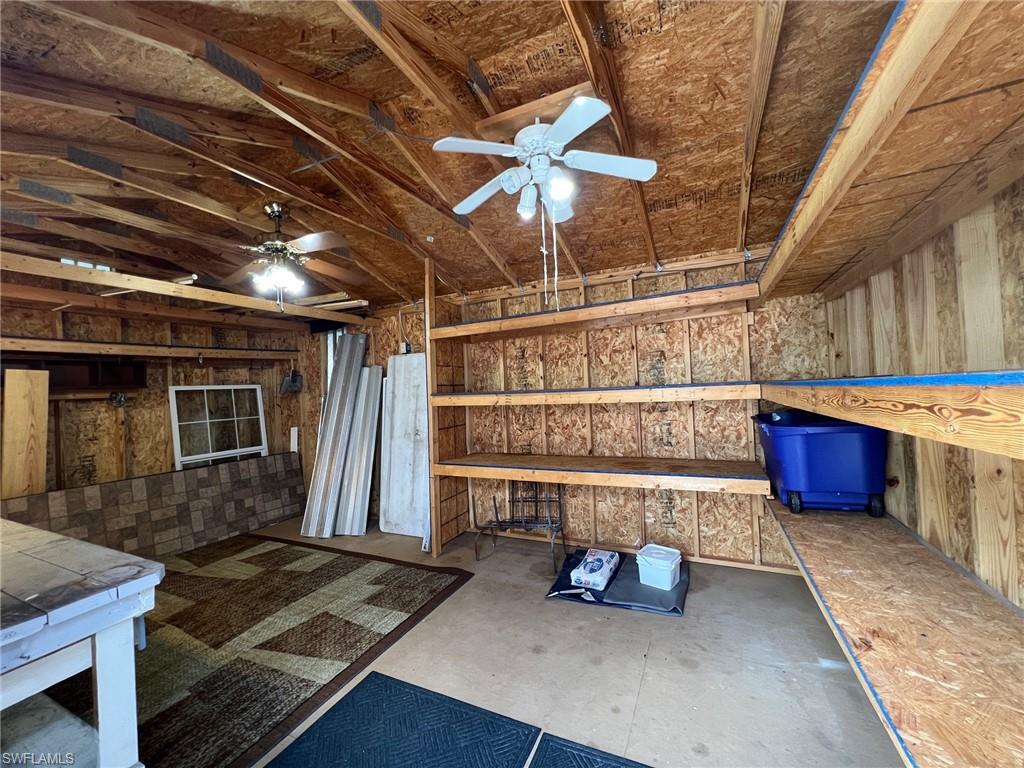 128 Mediterranean Way, Unit 128 Naples, FL 34104 - Photo 30 of 41 View of patio with a storage shed.