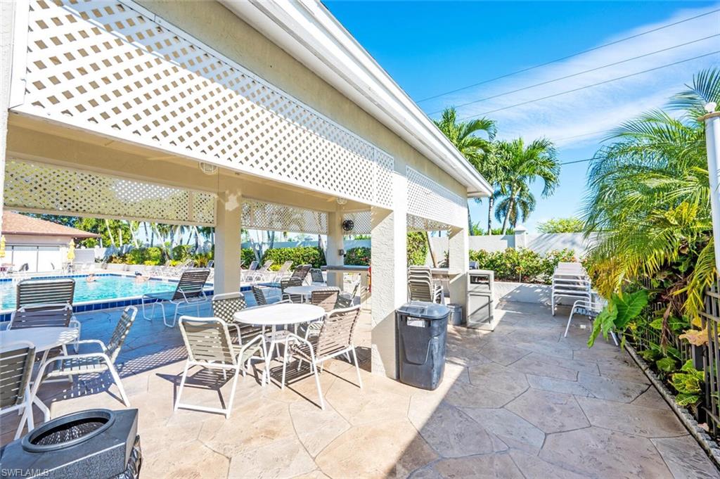 128 Mediterranean Way, Unit 128 Naples, FL 34104 - Photo 36 of 41 Community pool area