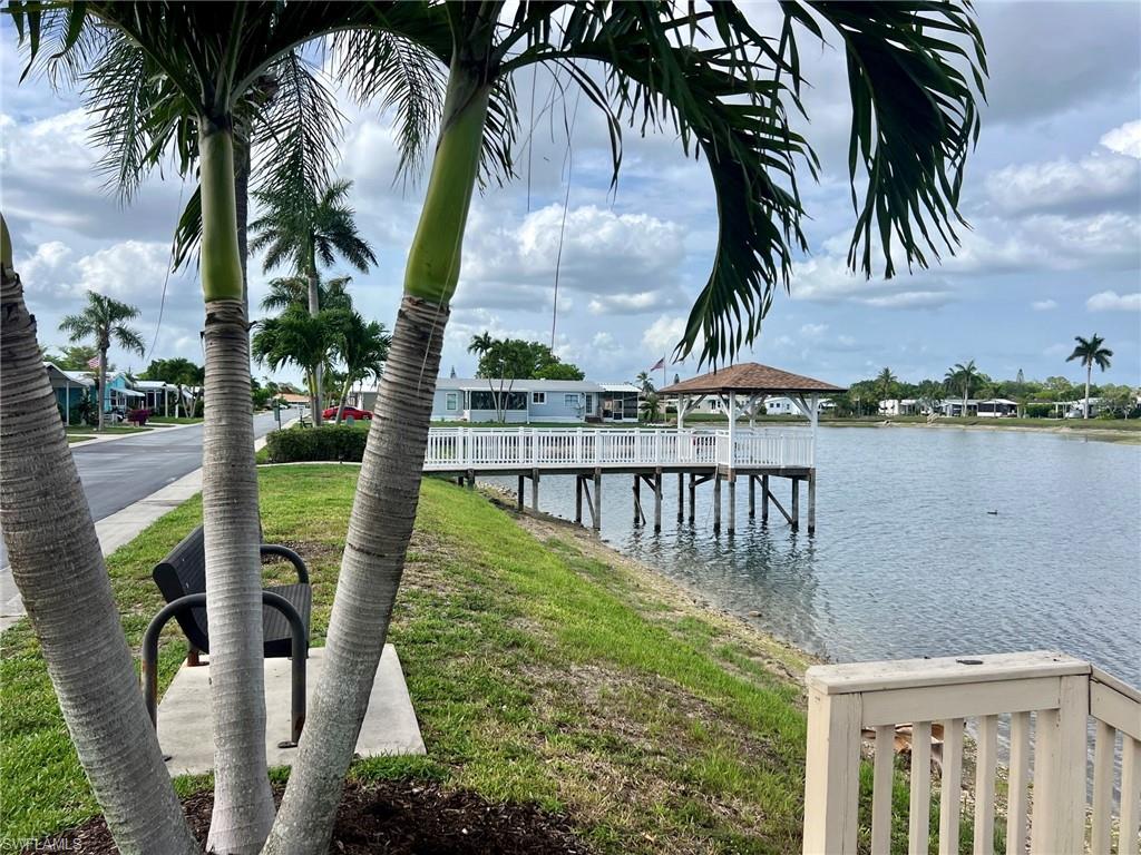 128 Mediterranean Way, Unit 128 Naples, FL 34104 - Photo 41 of 41 Pier and lake in Windjammer