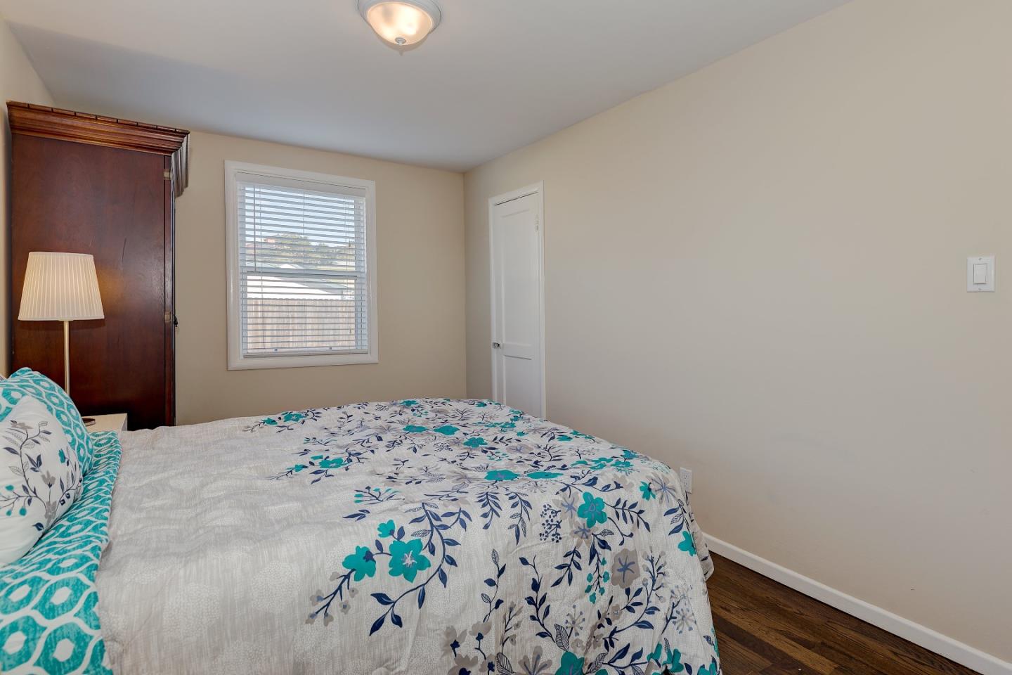 263 Clarendon Road Pacifica, CA 94044 - Photo 16 of 36 a bedroom with a bed and a window