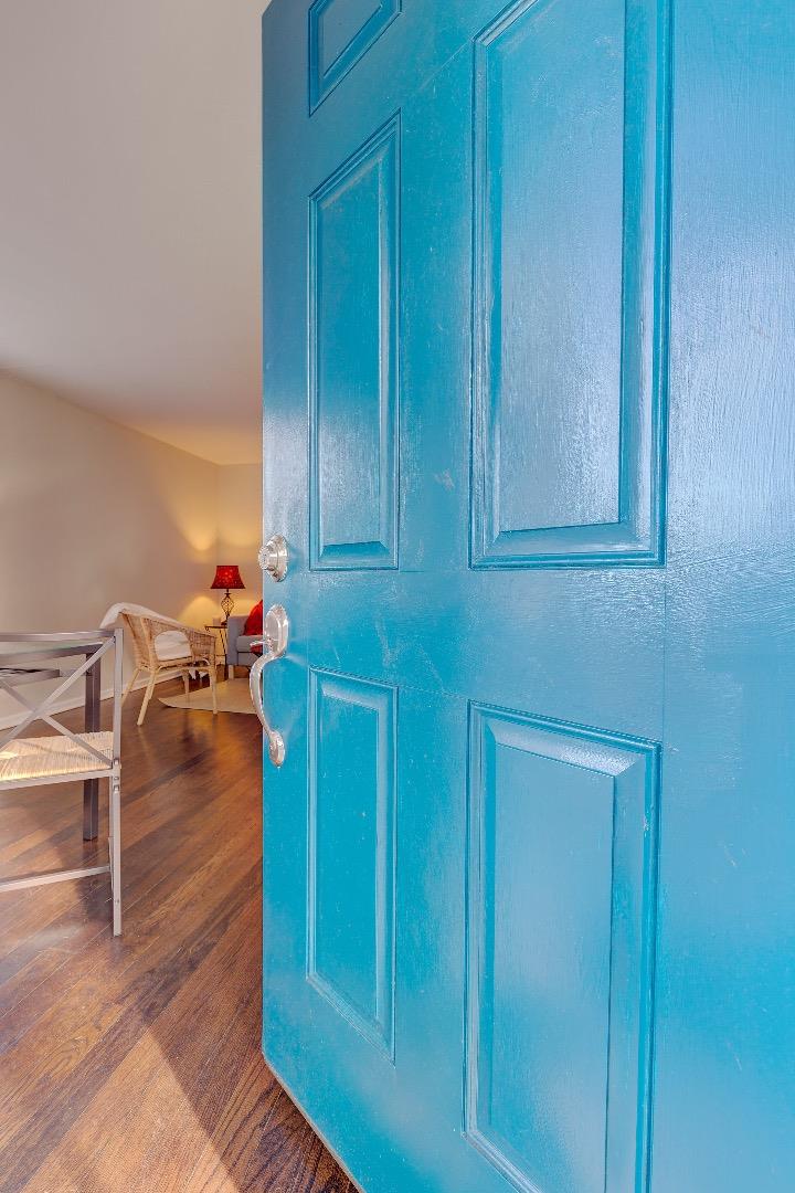 263 Clarendon Road Pacifica, CA 94044 - Photo 4 of 36 a view of a hallway with wooden floor and furniture